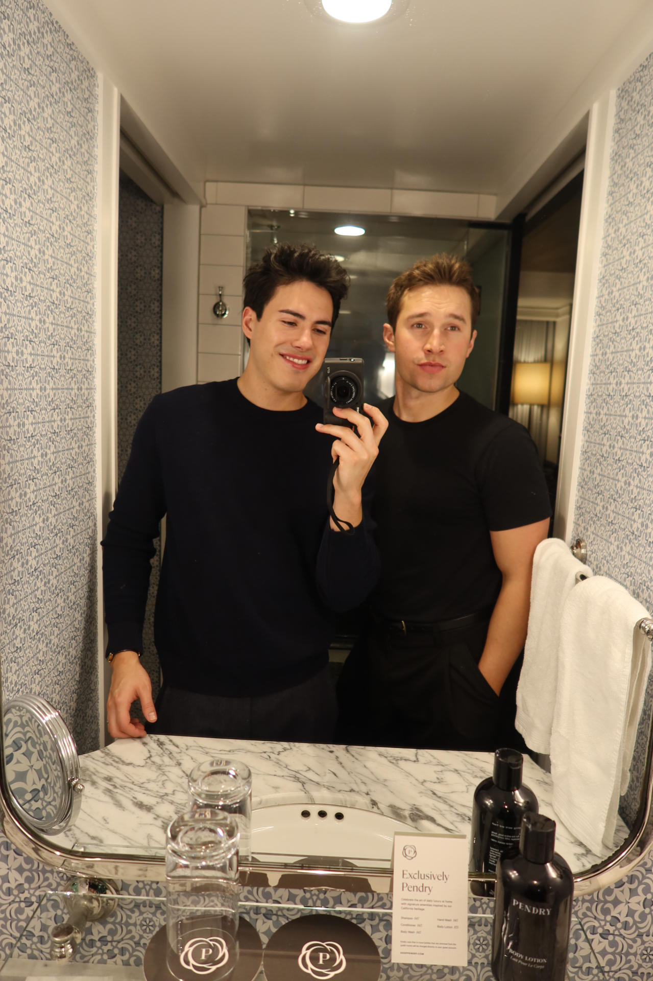 Griffin and Neiyell in a hotel bathroom mirror selfie at the Pendry